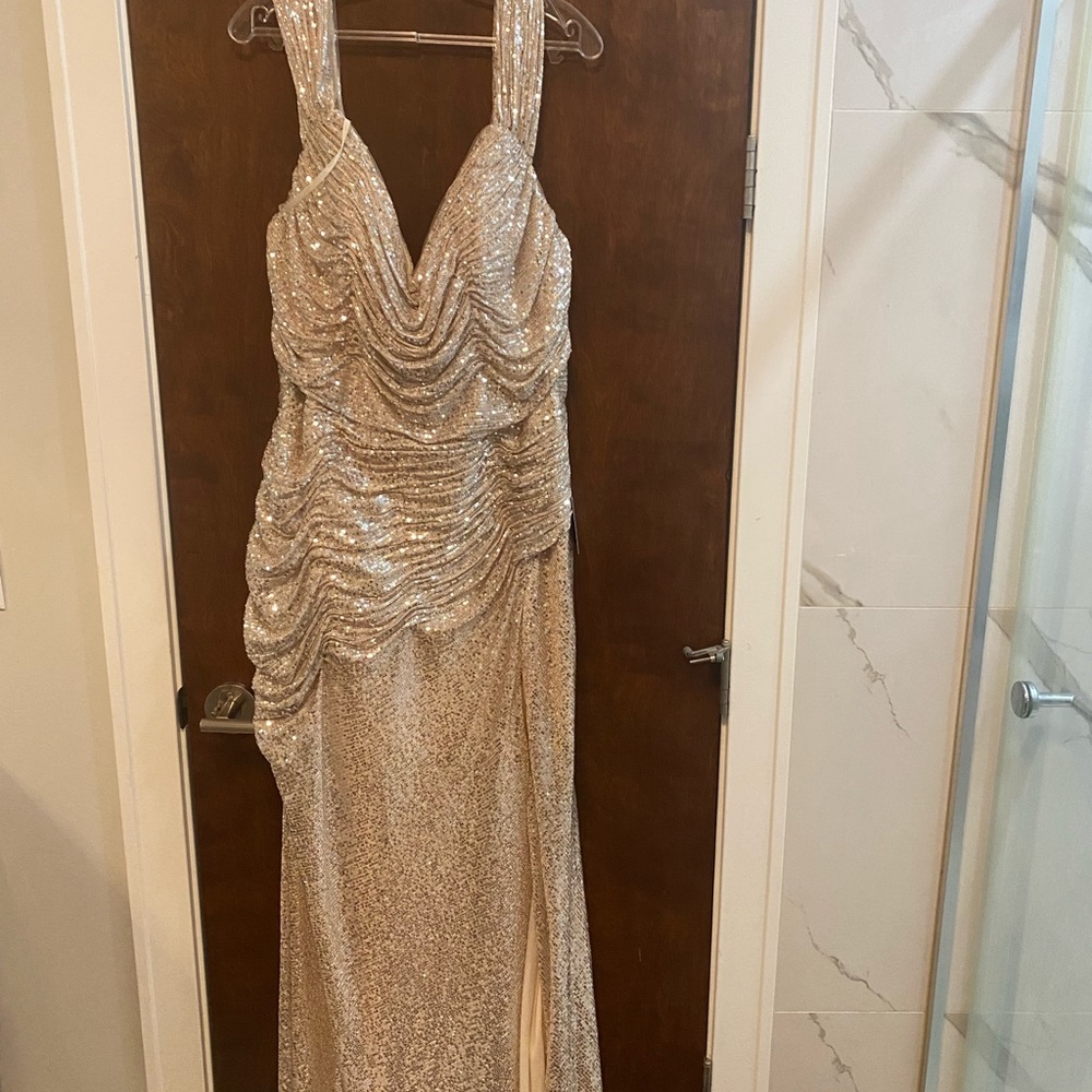 Silver evening gown never worn size 16